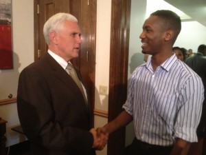 Governor Pence chats with City of Gary Dept. of Communications intern James Wells after the ceremony.